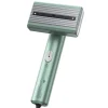 Mint green handheld garment steamer with steam vents.