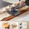 Epicka handheld garment steamer smoothing wrinkles on fabric, featuring 15s fast heating and two steam levels.
