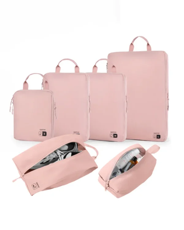Pink travel packing cube set with shoe and toiletry bags.