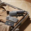 Ultra-slim portable travel garment steamer packed in suitcase with shirt, iPhone, and passport.