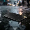 IP67 waterproof dustproof portable SSD on wet street with raindrops